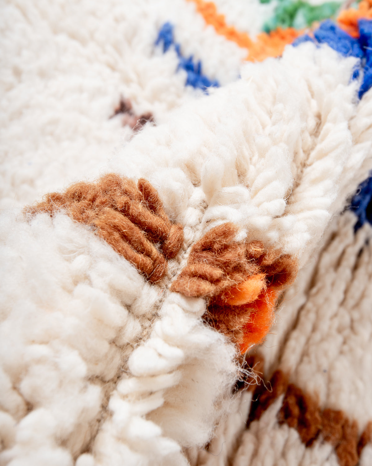 Modern, designer, handcrafted Berber rug from Morocco. Beniourain carpet with beautiful colours and patterns and fluffy wool texture.